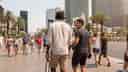 Two men walking the Las Vegas strip.